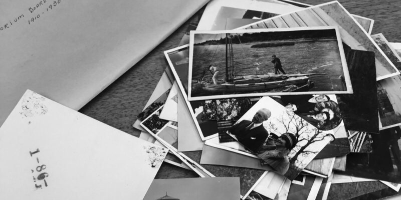 Photos and an envelope scattered on a table