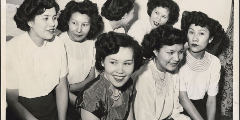 seven women sitting together.
