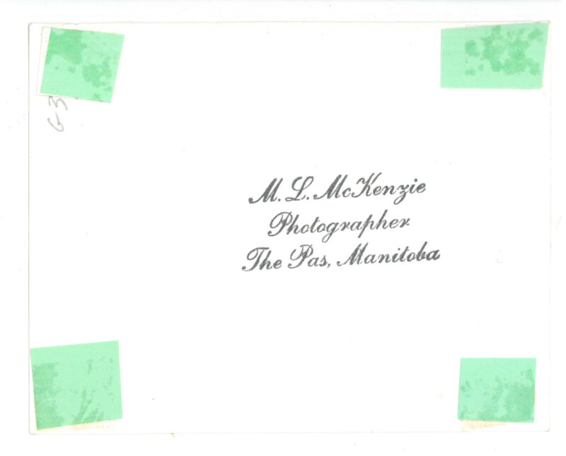 Verso: Photographer's Stamp: "M.L. McKenzie Photographer The Pas, Manitoba" // G3