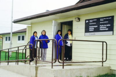Four women outside the Pukatawagan Nursing Station