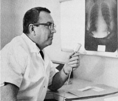 A man examines an x-ray