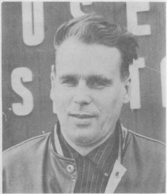A portrait of a man in a bomber jacket.