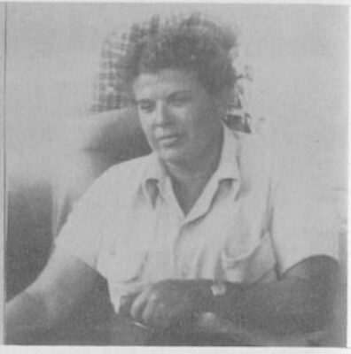 A portrait of a woman sitting in a chair.