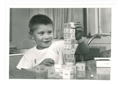 Boy playing with word blocks