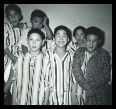 A group of boys in striped pyjamas.